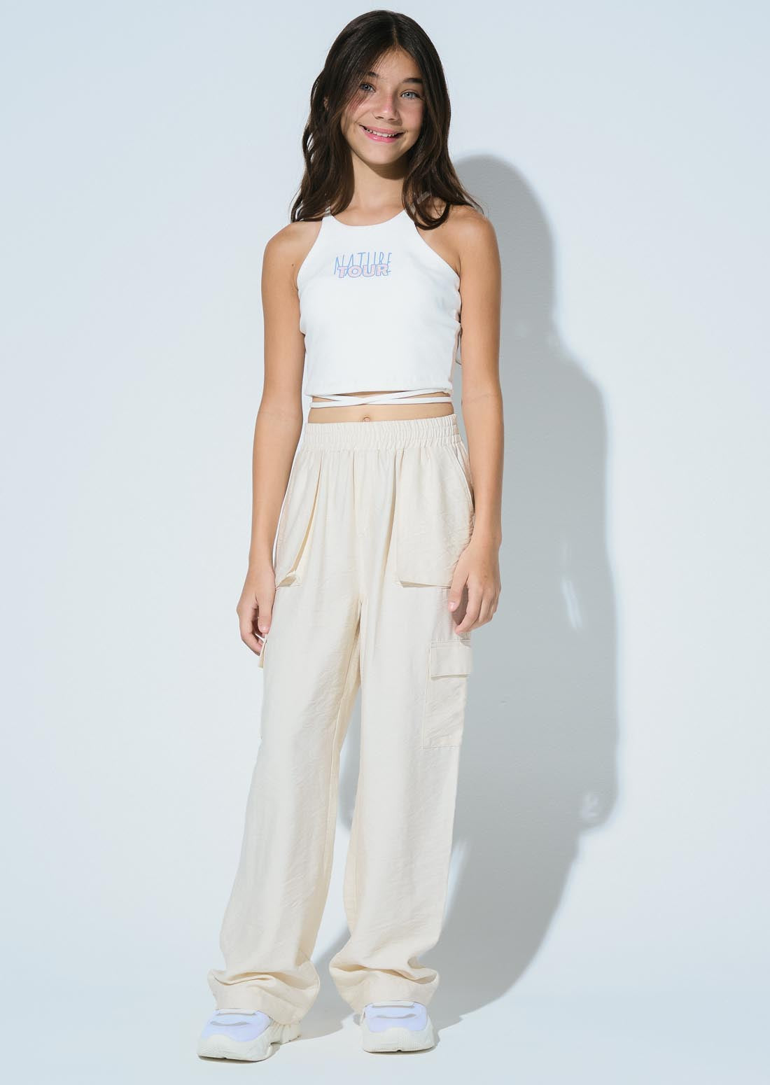 Pantalón marfil bolsillos en costados para niñas